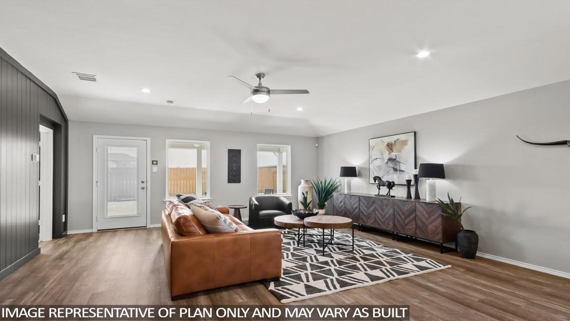 4265 Multnomah Falls Drive Conroe, TX 77303 - Photo 4 of 20 a living room with furniture and a rug