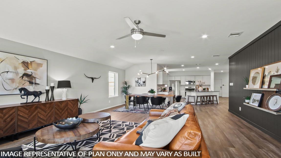 4265 Multnomah Falls Drive Conroe, TX 77303 - Photo 6 of 20 a living room with furniture and a wooden floor