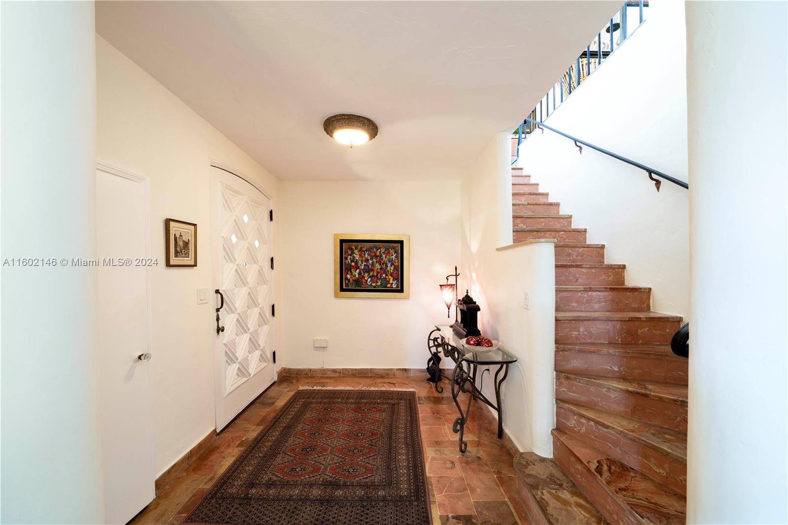 5801 Alton Road Miami Beach, FL 33140 - Photo 15 of 35 a view of entryway with wooden floor
