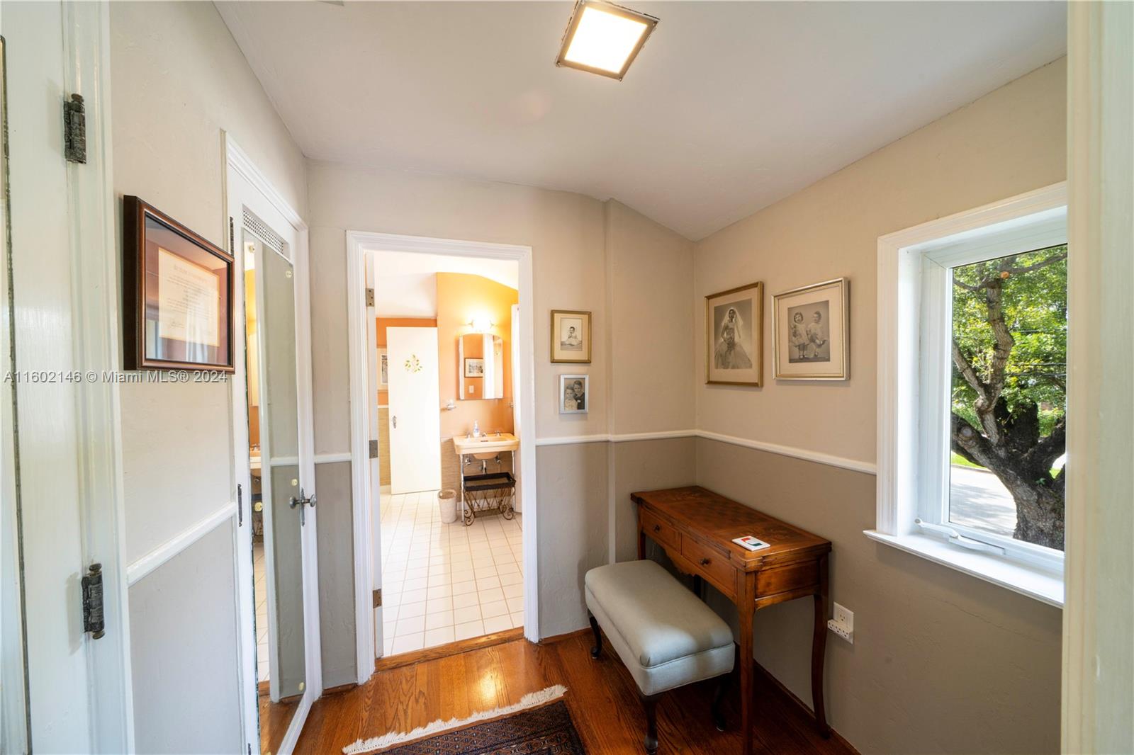 5801 Alton Road Miami Beach, FL 33140 - Photo 19 of 35 a living room with furniture and a window