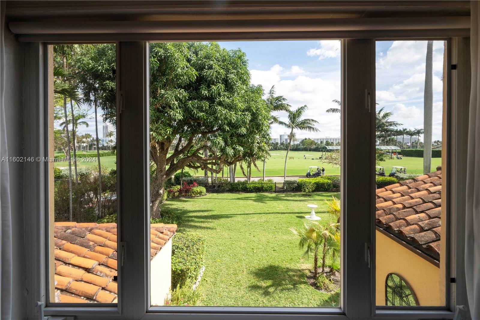5801 Alton Road Miami Beach, FL 33140 - Photo 20 of 35 a view of a garden from a window