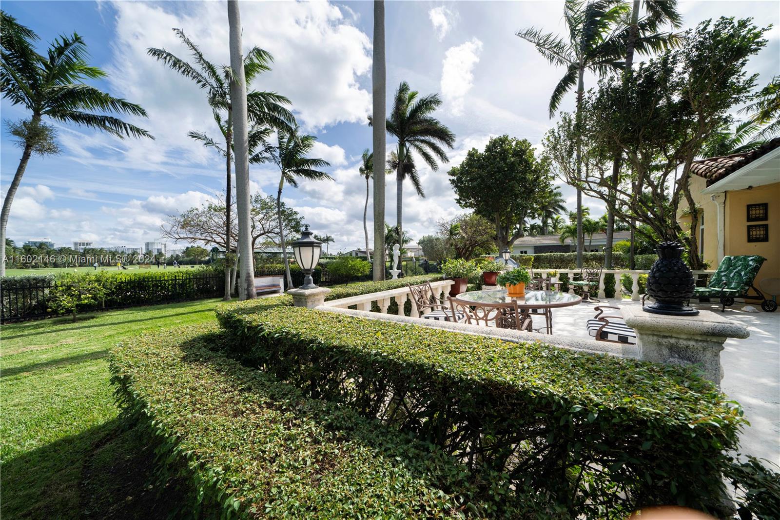 5801 Alton Road Miami Beach, FL 33140 - Photo 25 of 35 a view of a swimming pool and lounge chair