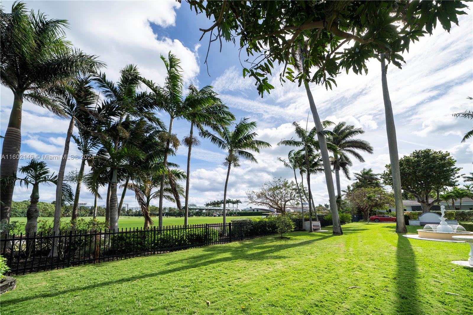 5801 Alton Road Miami Beach, FL 33140 - Photo 29 of 35 a view of swimming pool with palm trees and plants