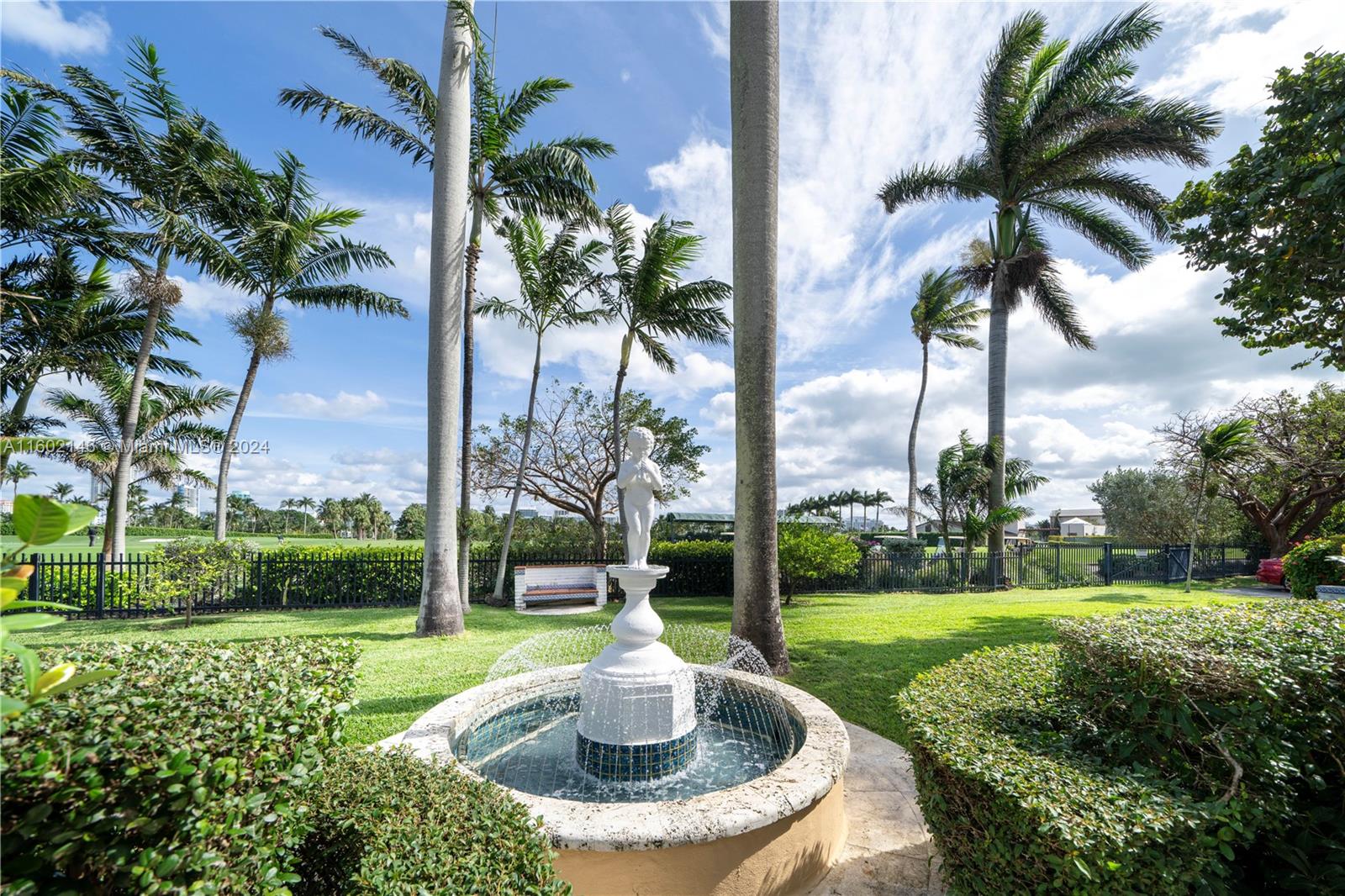 5801 Alton Road Miami Beach, FL 33140 - Photo 32 of 35 a swimming pool with outdoor seating and garden