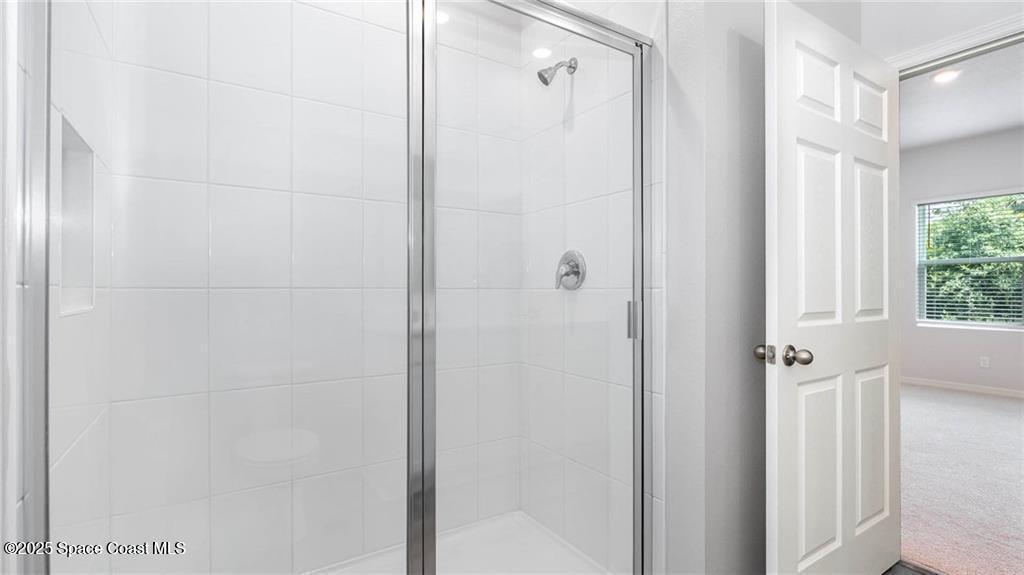 9036 Orchid Reserve Circle Sebastian, FL 32958 - Photo 19 of 25 a bathroom with a shower