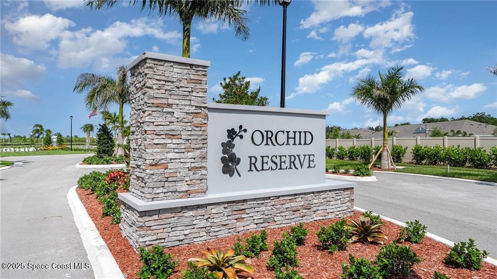 9036 Orchid Reserve Circle Sebastian, FL 32958 - Photo 2 of 25 a sign on the side of a road