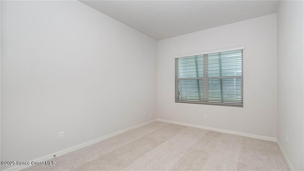 9036 Orchid Reserve Circle Sebastian, FL 32958 - Photo 21 of 25 an empty room with a window