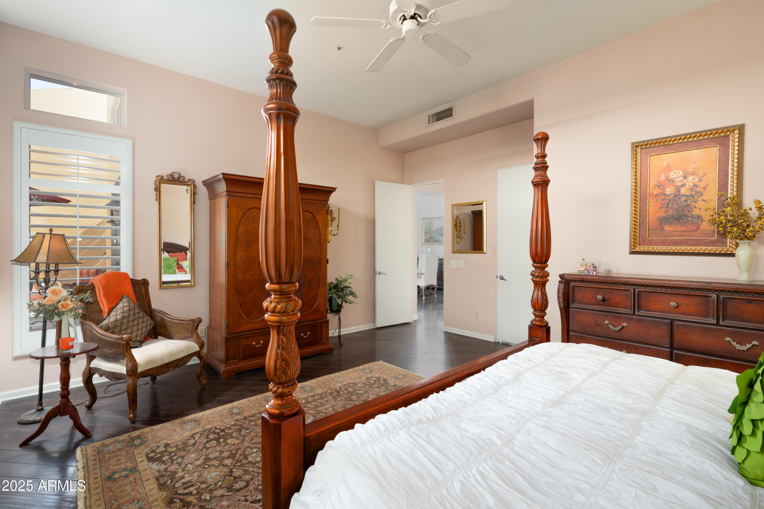 6711 East Camelback Road, Unit 21 Scottsdale, AZ 85251 - Photo 12 of 33 a bedroom with a bed and wooden floor