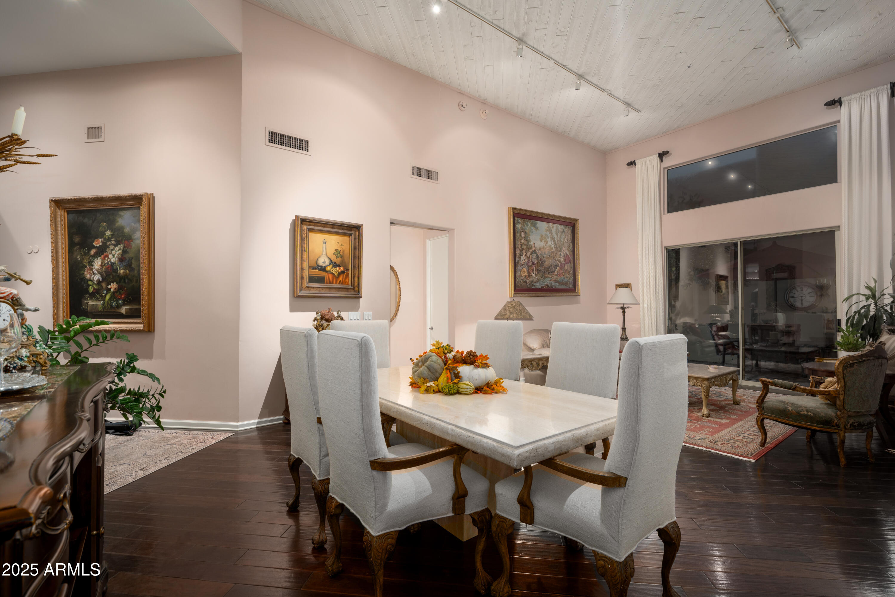 6711 East Camelback Road, Unit 21 Scottsdale, AZ 85251 - Photo 14 of 33 a view of a dining room with furniture window and wooden floor