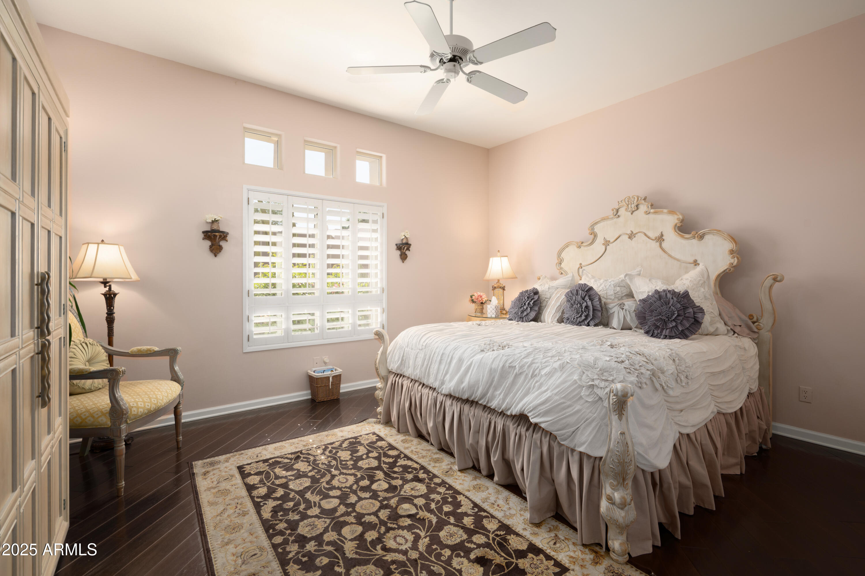 6711 East Camelback Road, Unit 21 Scottsdale, AZ 85251 - Photo 15 of 33 a bedroom with a bed and wooden floor