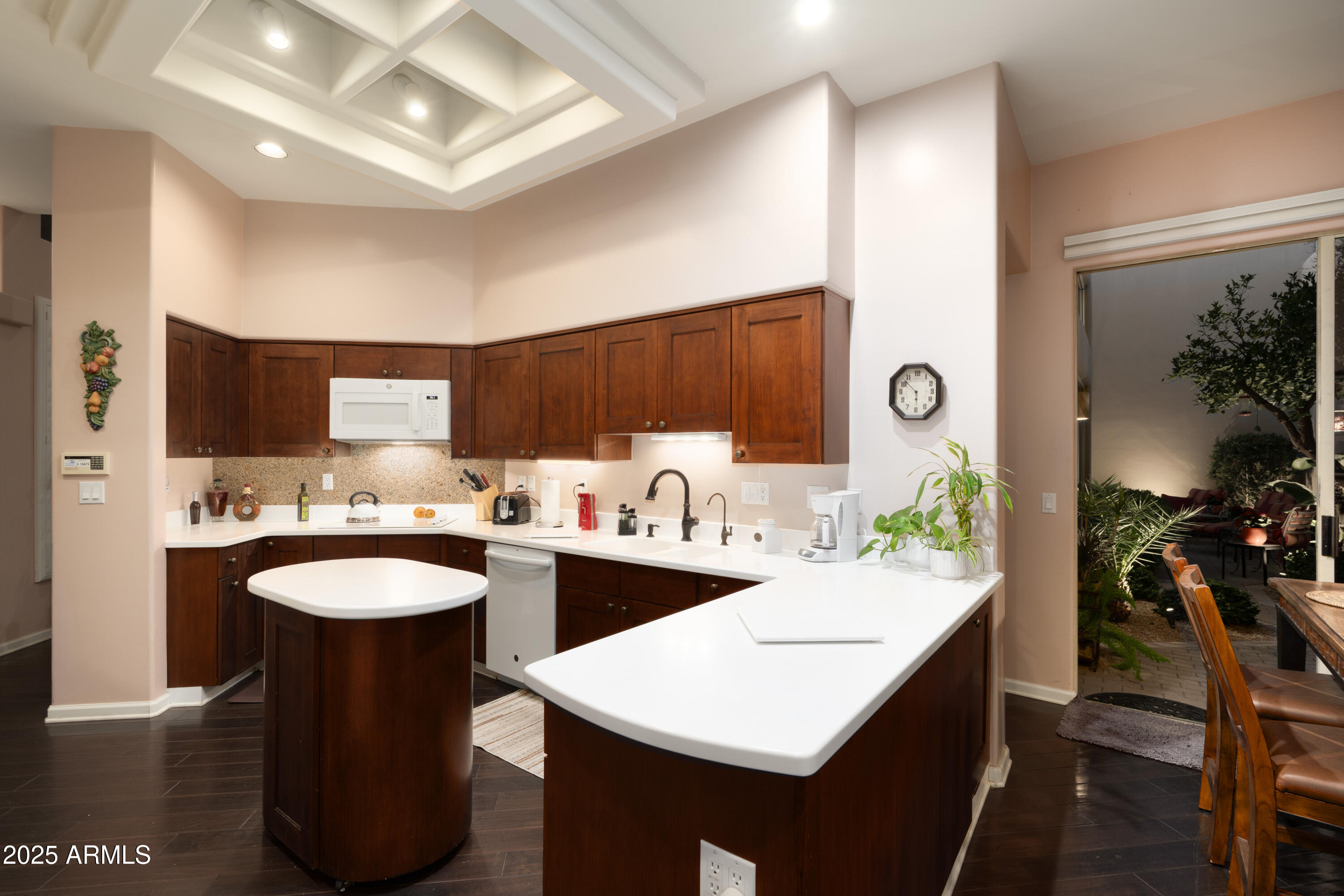 6711 East Camelback Road, Unit 21 Scottsdale, AZ 85251 - Photo 18 of 33 a kitchen with a sink a stove and cabinets