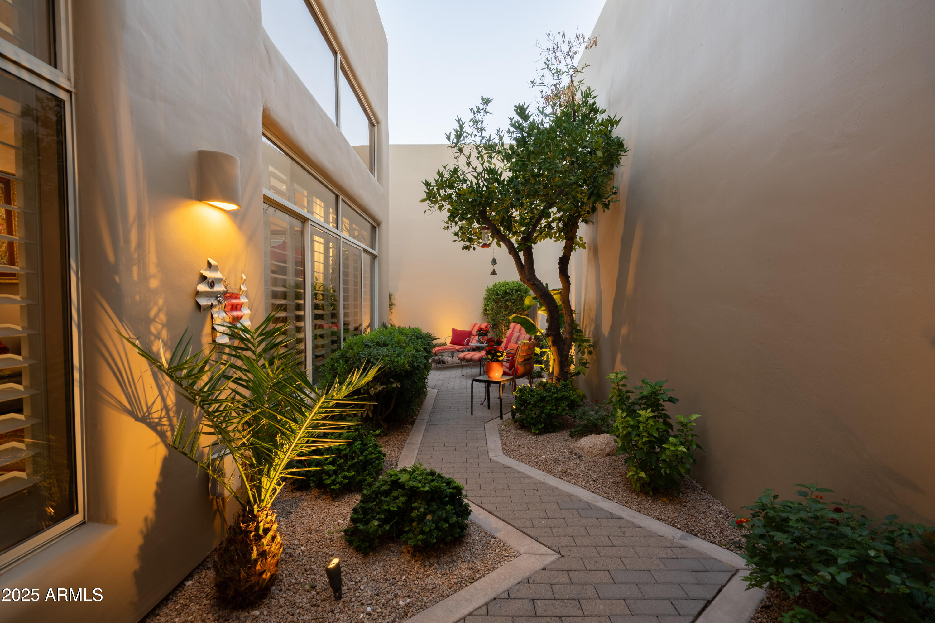 6711 East Camelback Road, Unit 21 Scottsdale, AZ 85251 - Photo 20 of 33 a potted plant sitting in front of a door
