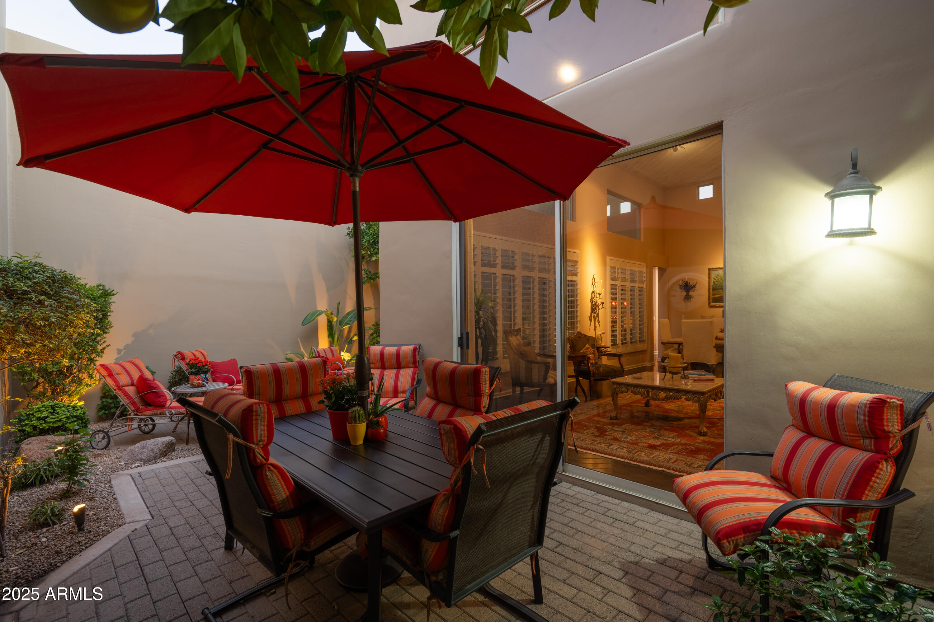 6711 East Camelback Road, Unit 21 Scottsdale, AZ 85251 - Photo 23 of 33 an outdoor space with furniture and umbrella