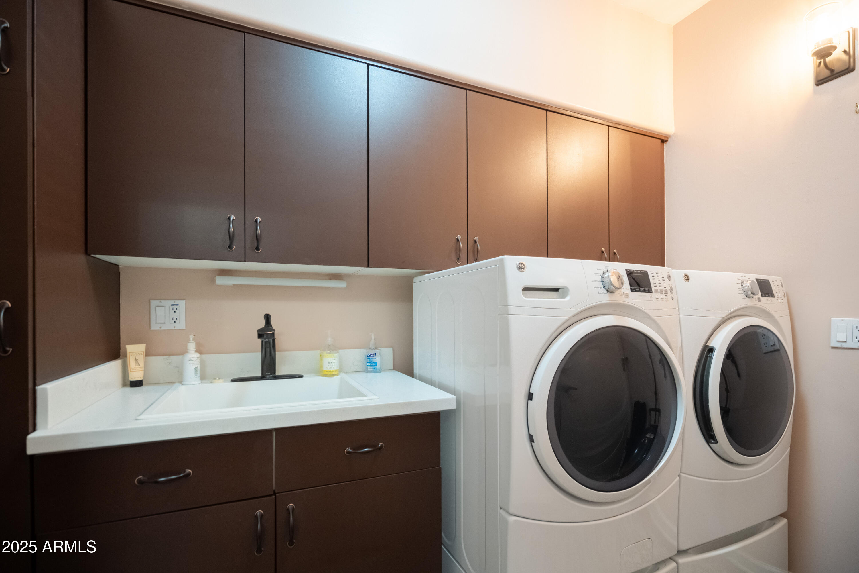 6711 East Camelback Road, Unit 21 Scottsdale, AZ 85251 - Photo 24 of 33 a utility room with dryer and washer
