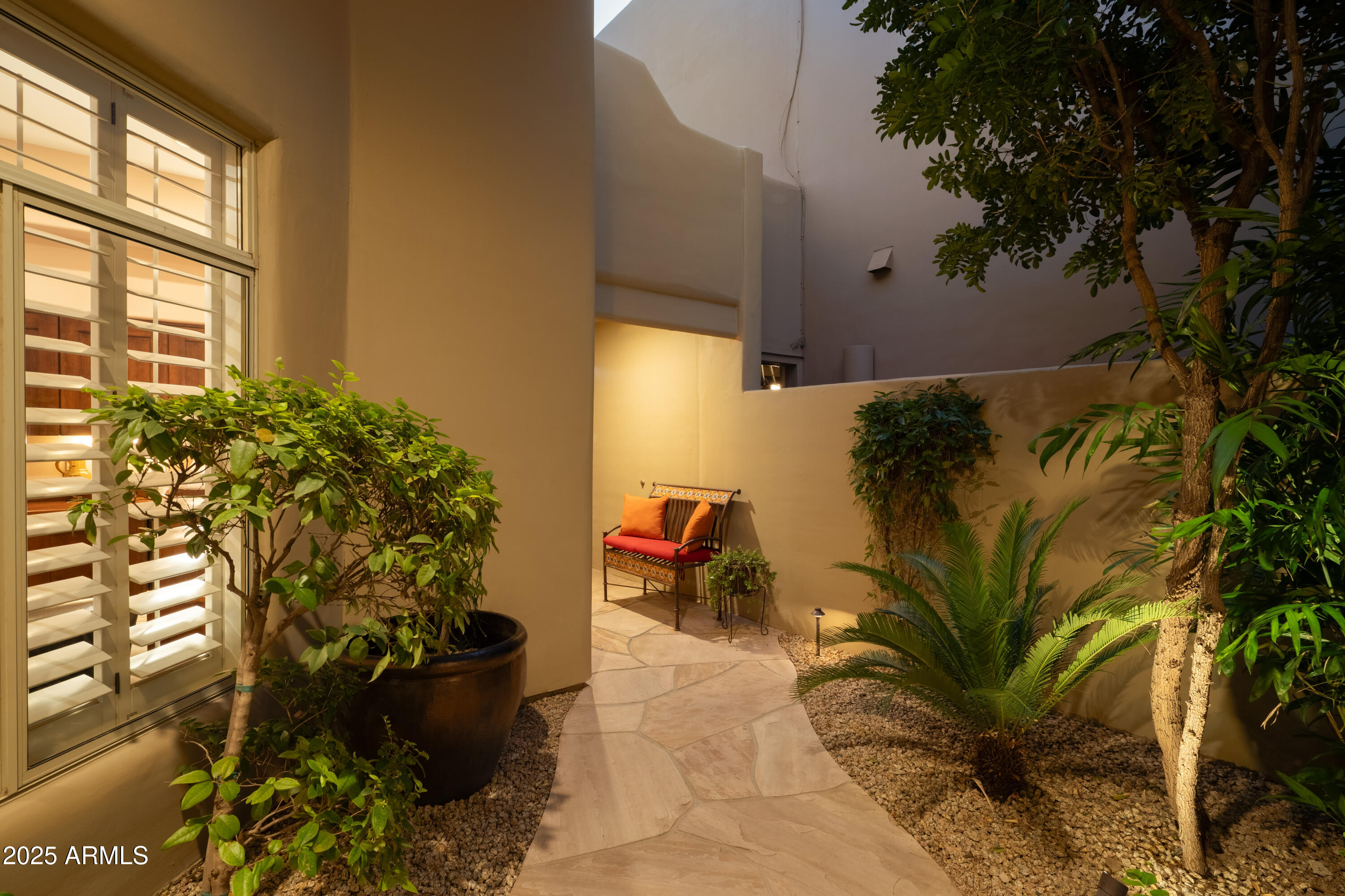 6711 East Camelback Road, Unit 21 Scottsdale, AZ 85251 - Photo 25 of 33 a plant is in front of a house