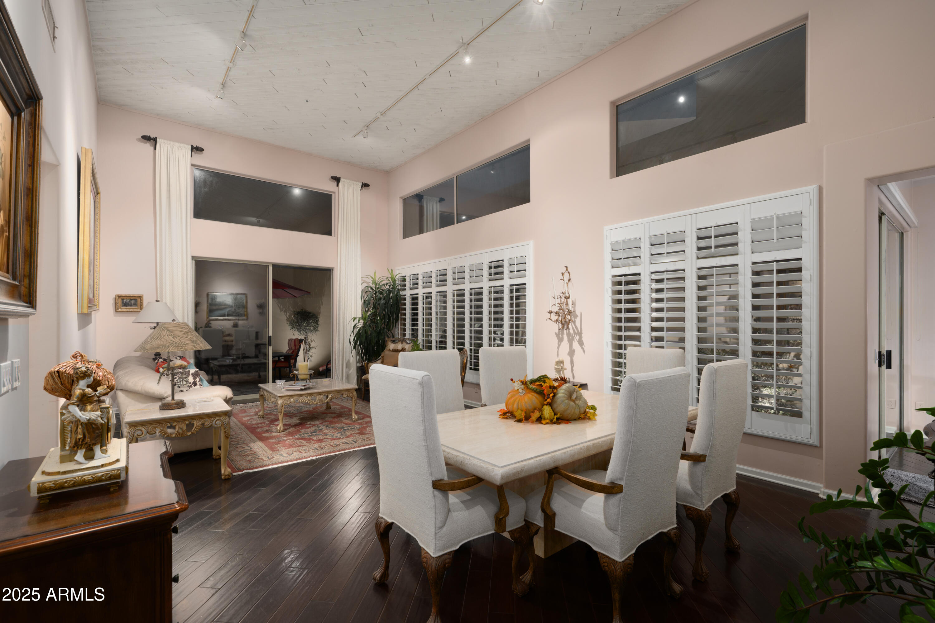 6711 East Camelback Road, Unit 21 Scottsdale, AZ 85251 - Photo 9 of 33 a view of a dining room with furniture window and wooden floor