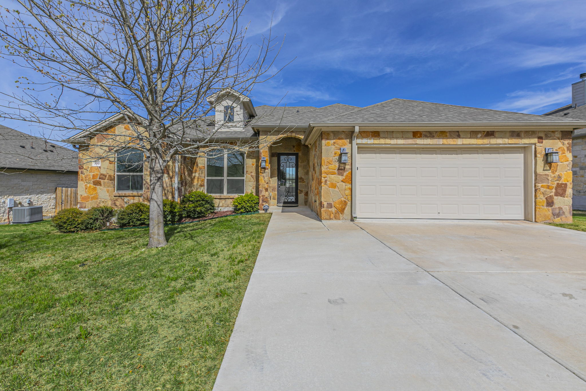 front view of a house with a small yard