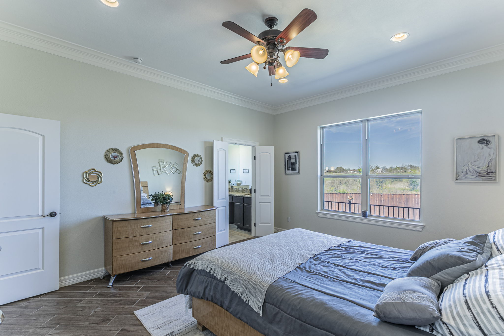 300 Magan Lane Jarrell, TX 76537 - Photo 14 of 33 Bedroom featuring ornamental molding, wood finish floors, ceiling fan, ensuite bathroom, and recessed lighting
