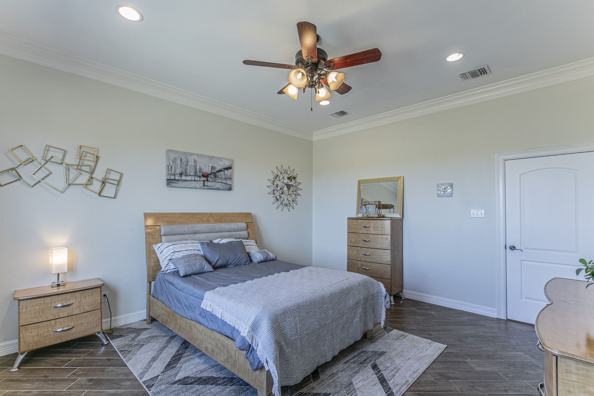300 Magan Lane Jarrell, TX 76537 - Photo 15 of 33 Bedroom featuring wood finish floors, crown molding, ceiling fan, and recessed lighting
