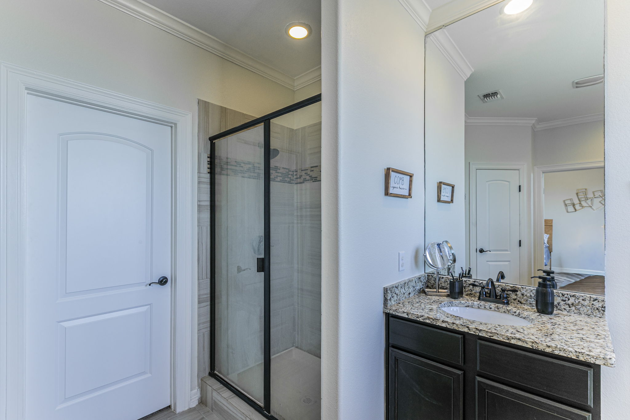 300 Magan Lane Jarrell, TX 76537 - Photo 16 of 33 Bathroom with vanity, a stall shower, crown molding, and recessed lighting