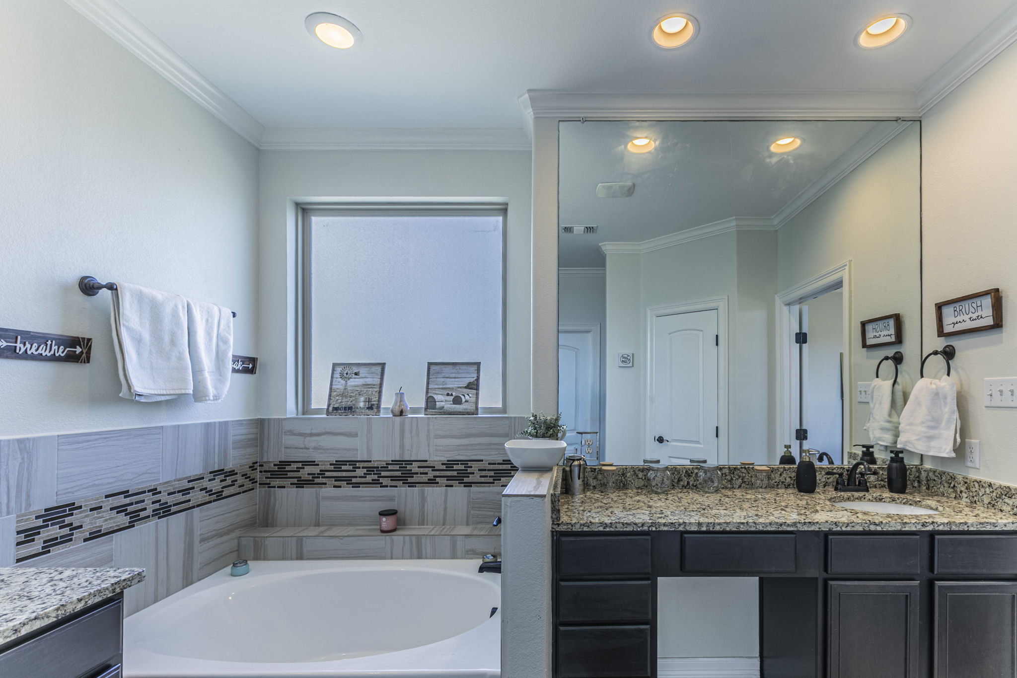 300 Magan Lane Jarrell, TX 76537 - Photo 17 of 33 Full bath with vanity, a bath, ornamental molding, and recessed lighting