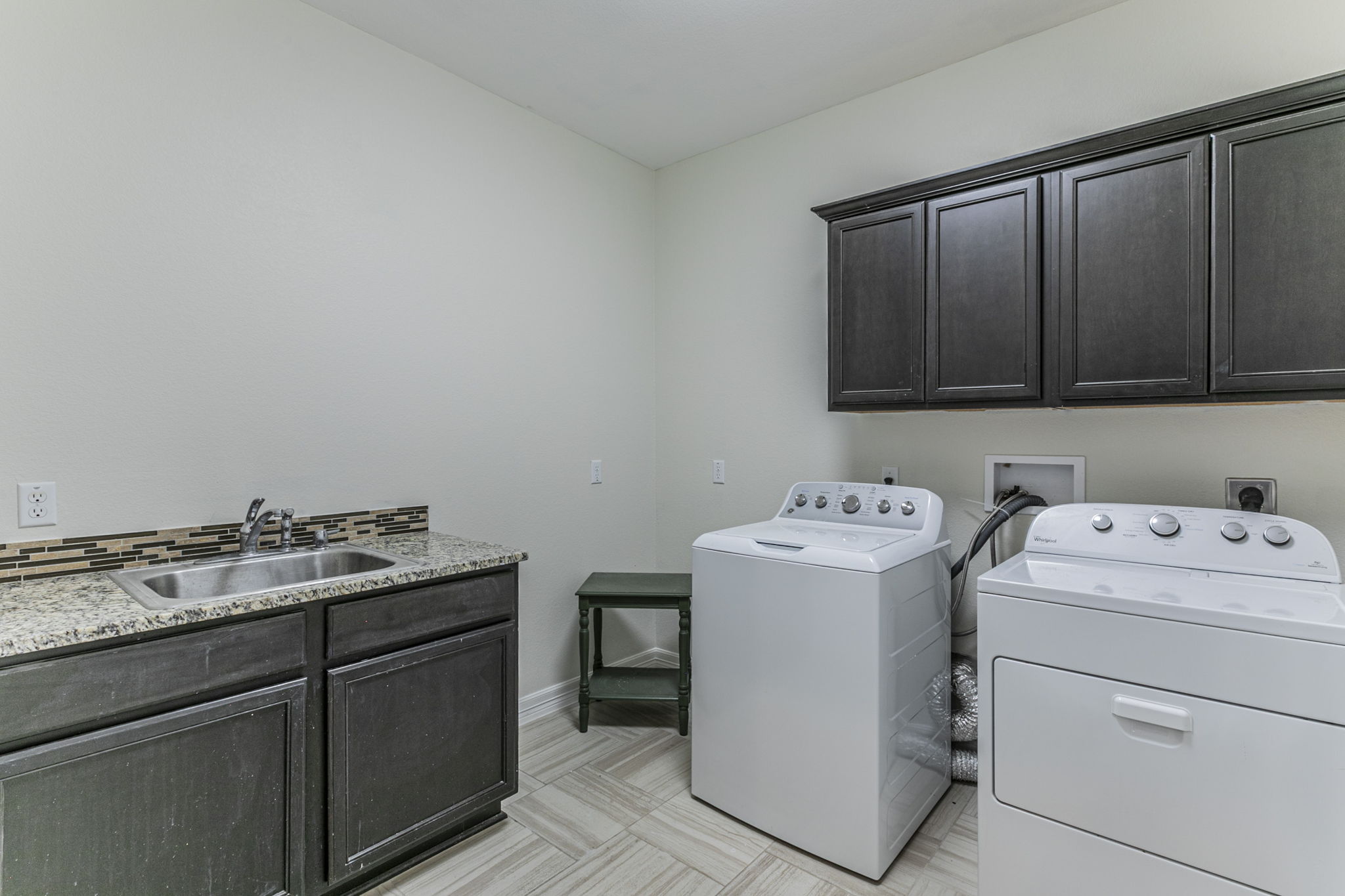 300 Magan Lane Jarrell, TX 76537 - Photo 21 of 33 Laundry room with cabinet space, independent washer and dryer, and light floors
