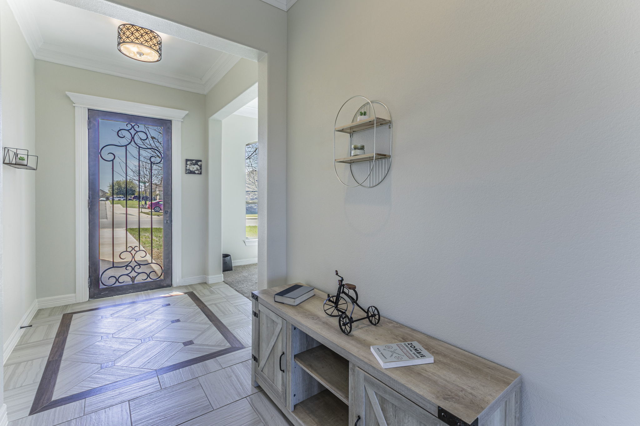 300 Magan Lane Jarrell, TX 76537 - Photo 22 of 33 Foyer featuring ornamental molding and parquet floors