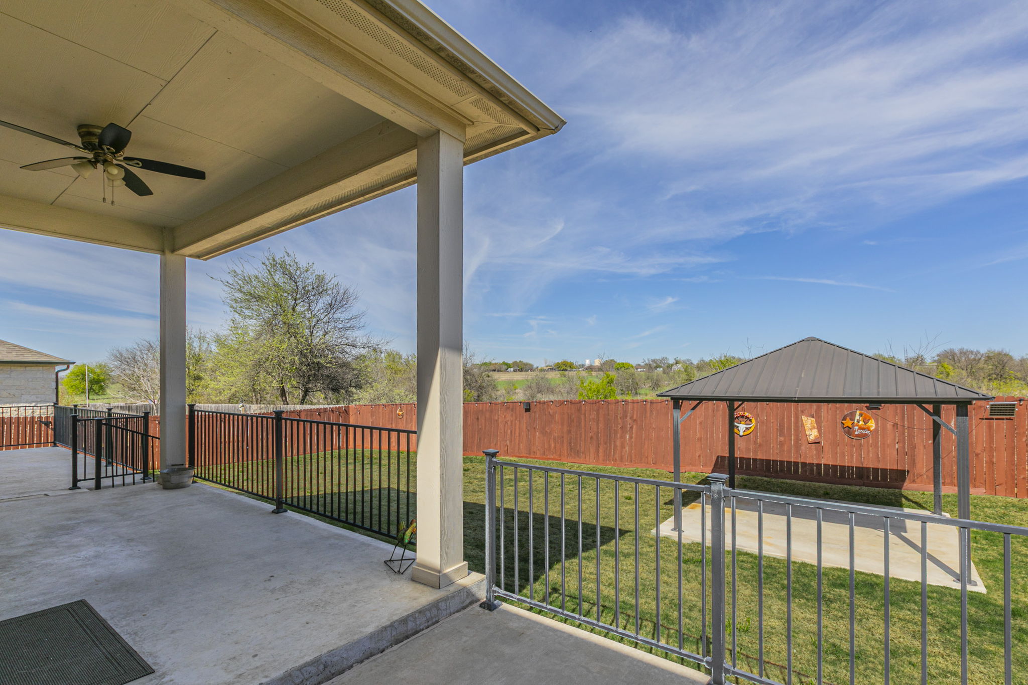 300 Magan Lane Jarrell, TX 76537 - Photo 25 of 33 Fenced backyard with a patio area, a ceiling fan, and a gazebo