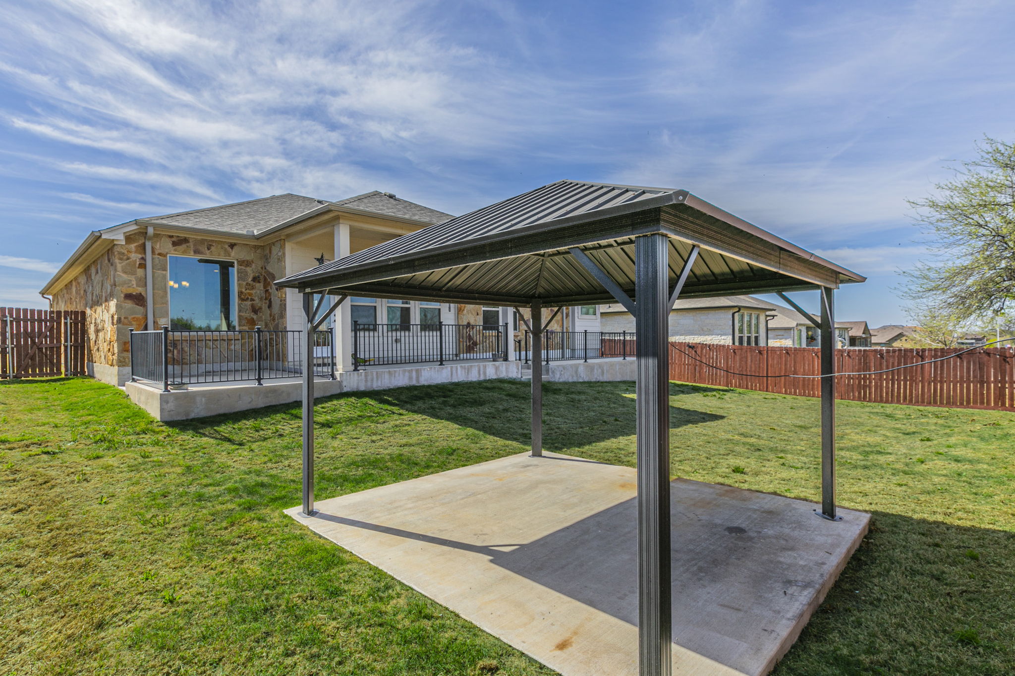 300 Magan Lane Jarrell, TX 76537 - Photo 26 of 33 Fenced backyard with a patio and a gazebo