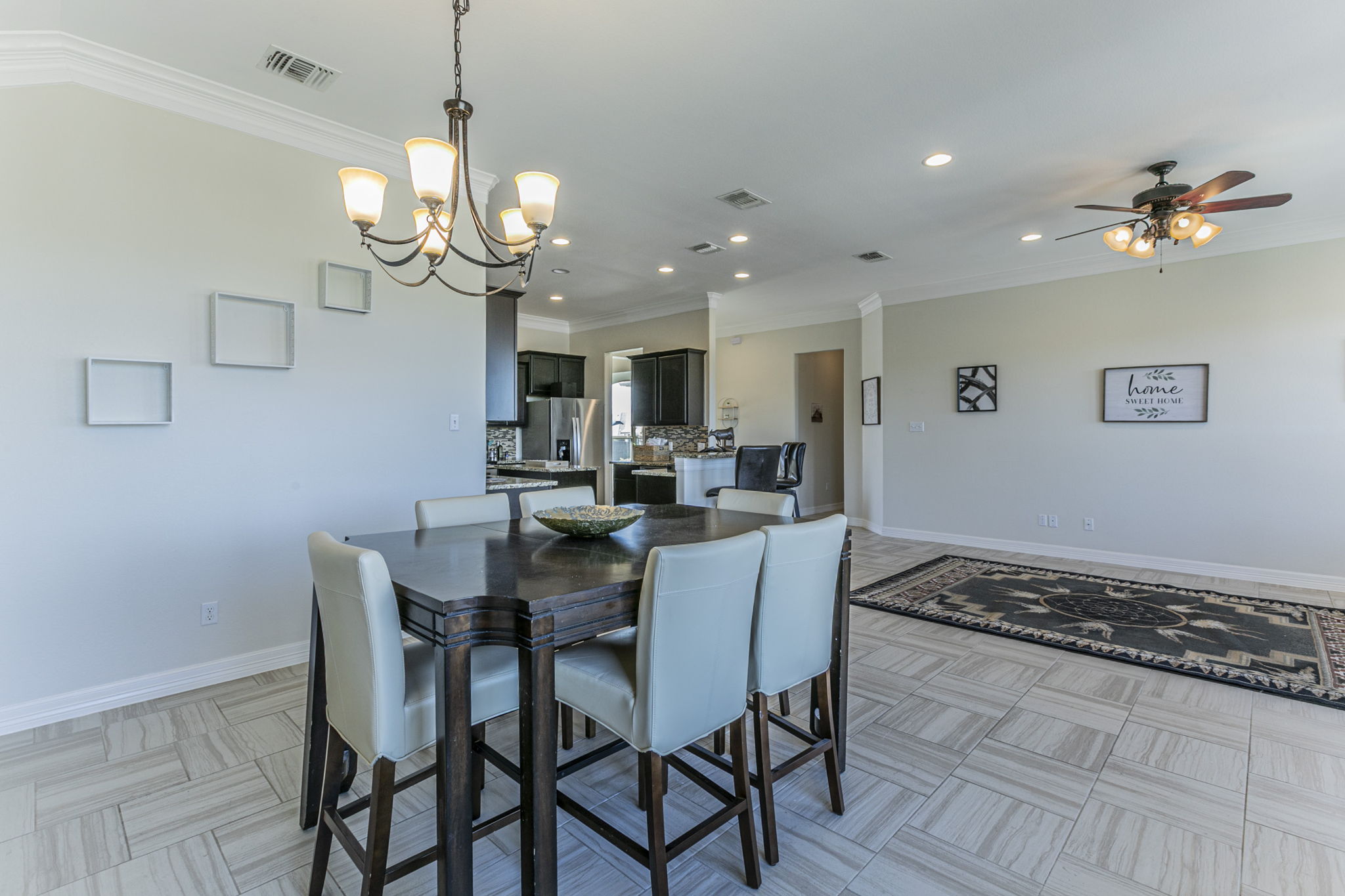 300 Magan Lane Jarrell, TX 76537 - Photo 10 of 33 Dining area featuring suspended lighting, ornamental molding, and ceiling fan