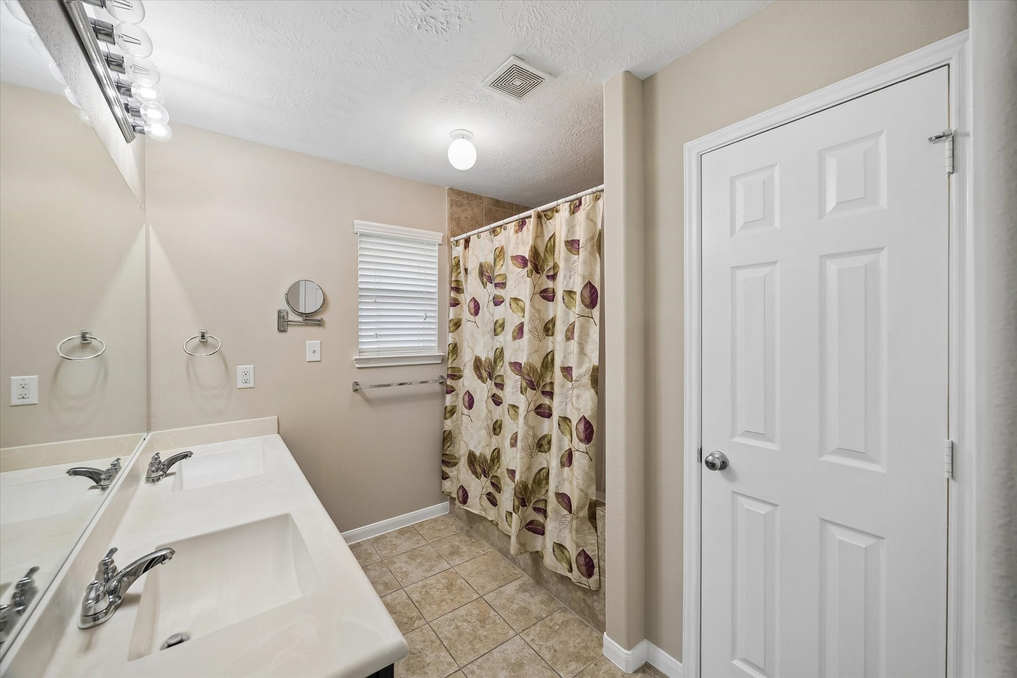 8433 Sunset Loch Drive Spring, TX 77379 - Photo 17 of 25 a bathroom with a sink and a shower