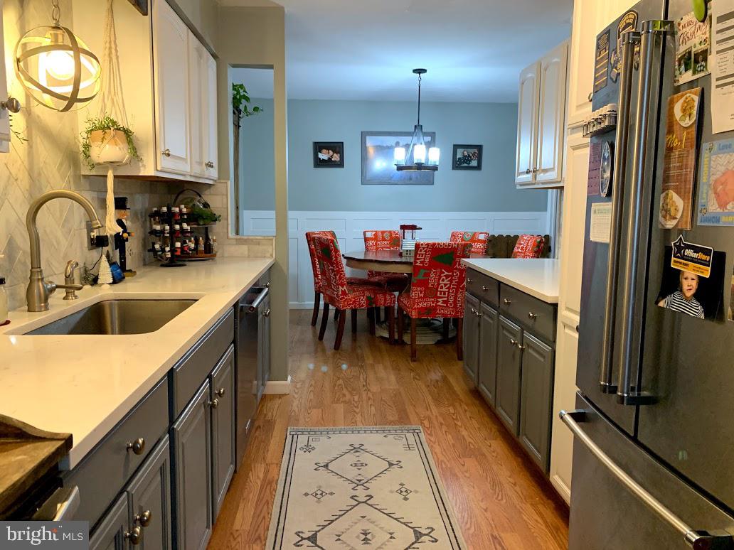404 Mitti Road Reading, PA 19607 - Photo 12 of 37 a kitchen with stainless steel appliances granite countertop a sink a stove and a refrigerator