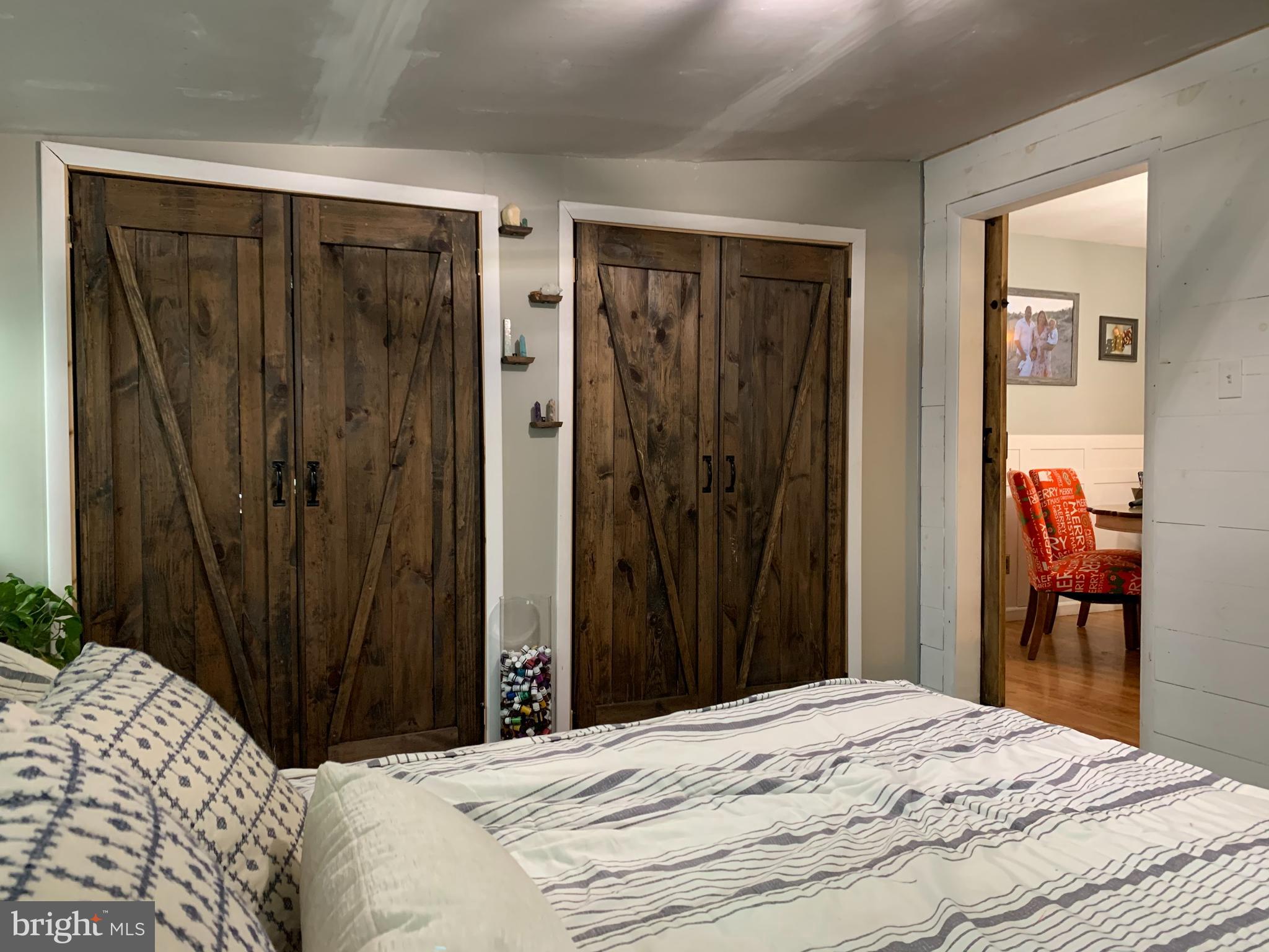 404 Mitti Road Reading, PA 19607 - Photo 20 of 37 a bedroom with a bed and a mirror