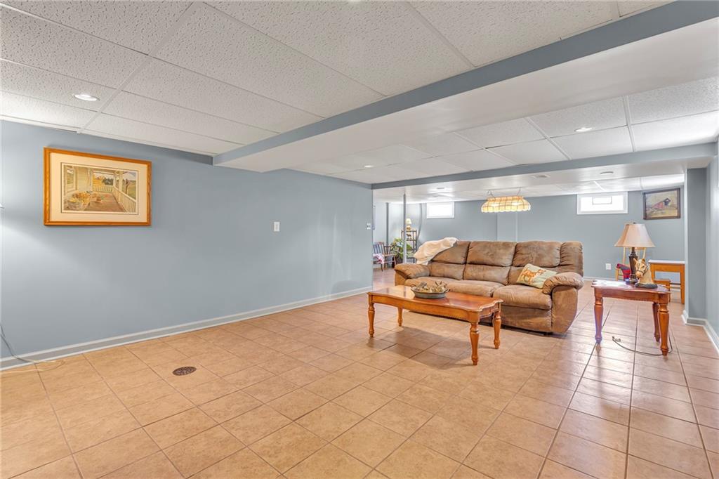 383 Ridgemont Drive Midland, PA 15059 - Photo 18 of 44 a living room with furniture and painting on the wall