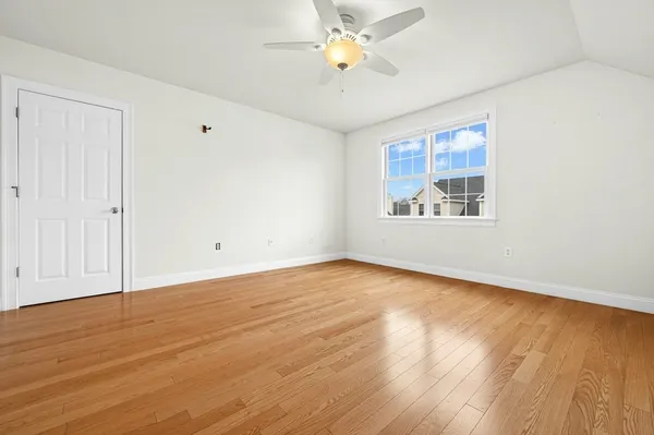 a bathroom with a sink a toilet and a large mirror