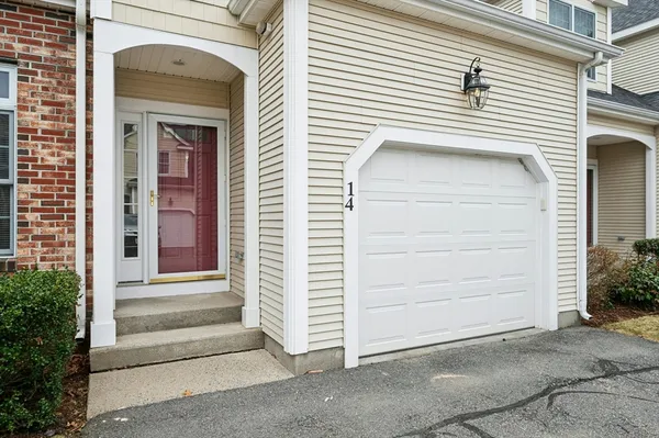 a view of a house with a door and wooden door