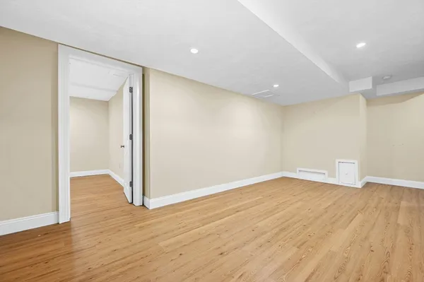 a work room with furniture and wooden floor