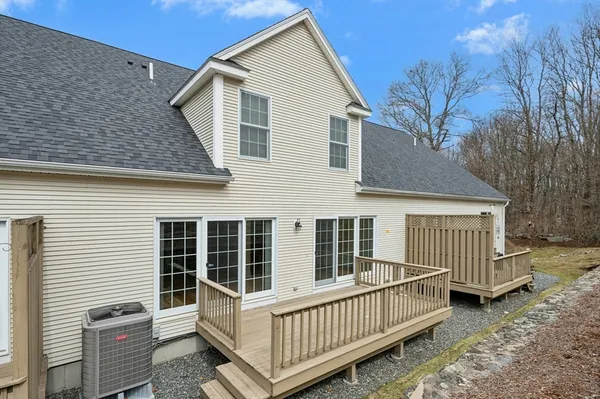 a view of a wooden deck with a yard