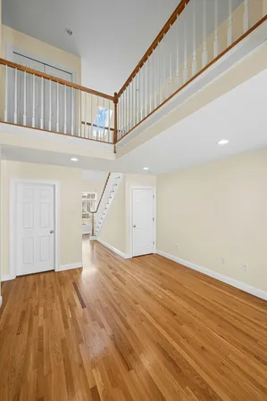 a view of an entryway with wooden floor