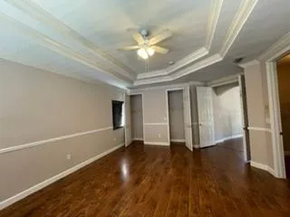 a view of balcony with wooden floor and fence
