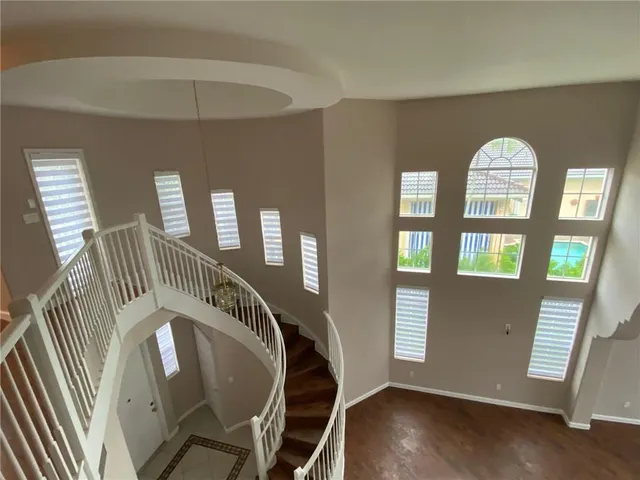a view of an entryway door with a staircase
