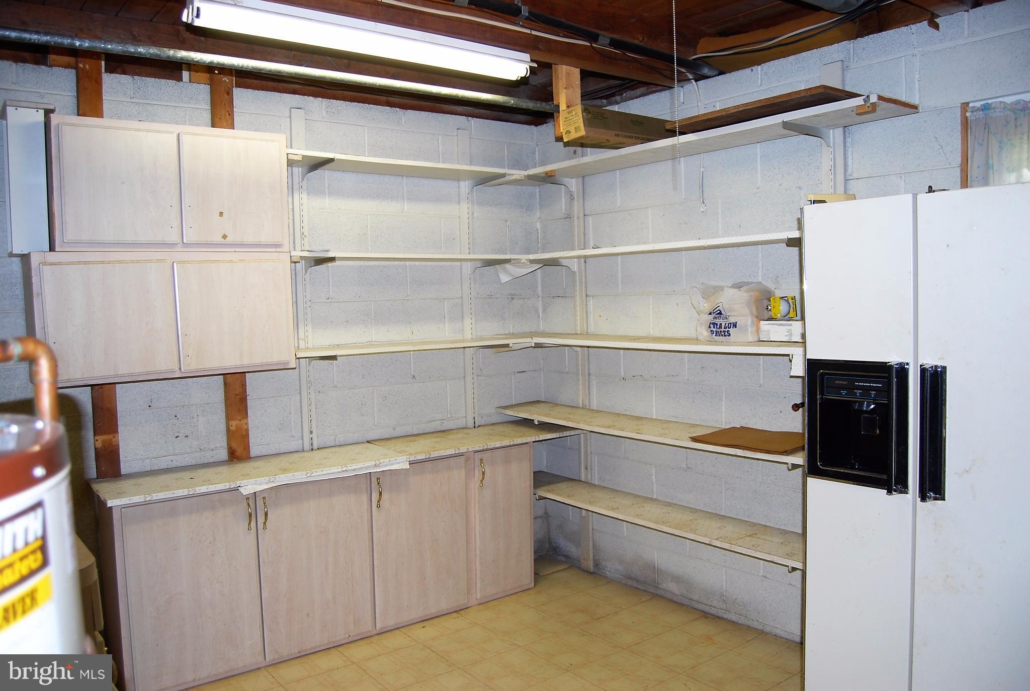 602 Running Fox Road Lusby, MD 20657 - Photo 29 of 30 Utility Room with Storage and extra refrigerator