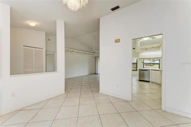 a kitchen with a white stove top oven and refrigerator