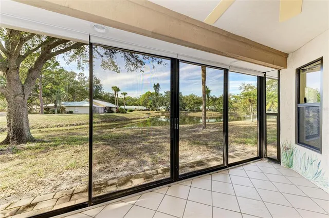 a view of a house with a yard and sitting area
