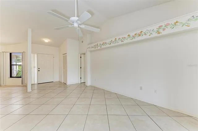 a view of an empty room with a window