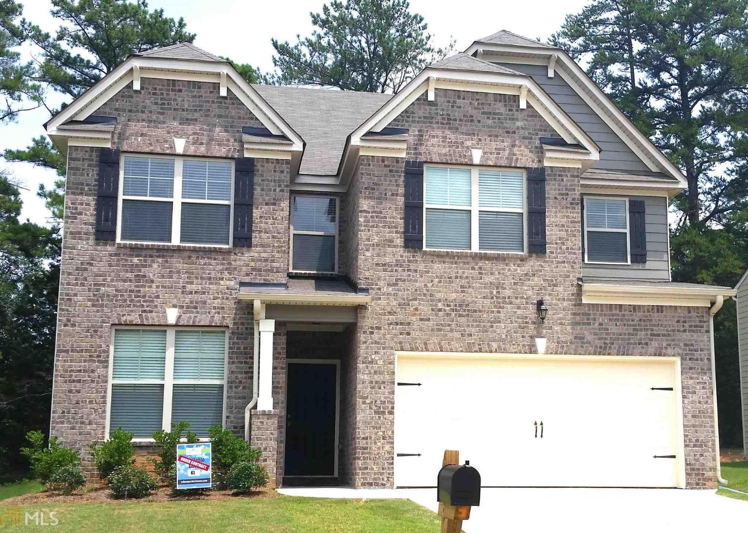 1413 Stone Ridge Court, Unit 166 Hampton, GA 30228 - Photo 1 of 1 a front view of a house with garden