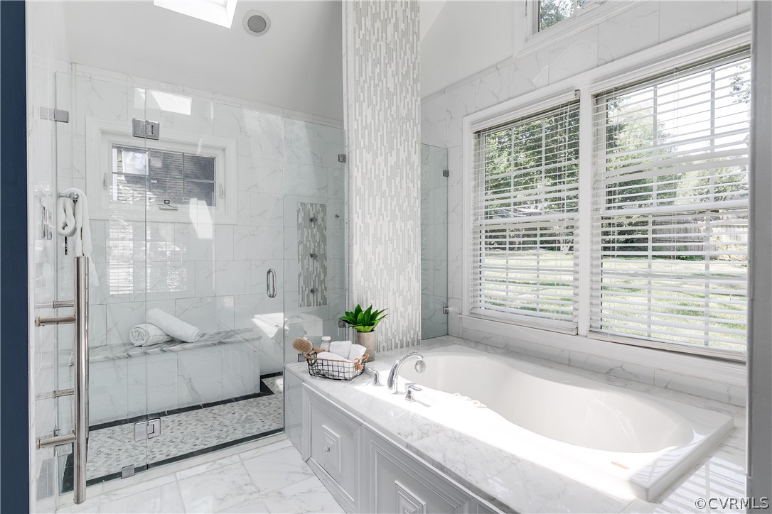 7607 Cherokee Road Richmond, VA 23225 - Photo 19 of 37 a bathroom with a granite countertop bathtub shower and mirror