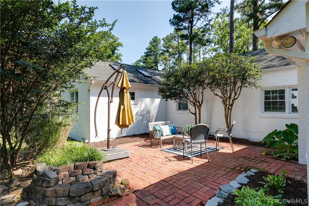 7607 Cherokee Road Richmond, VA 23225 - Photo 30 of 37 a view of a house with backyard and sitting area