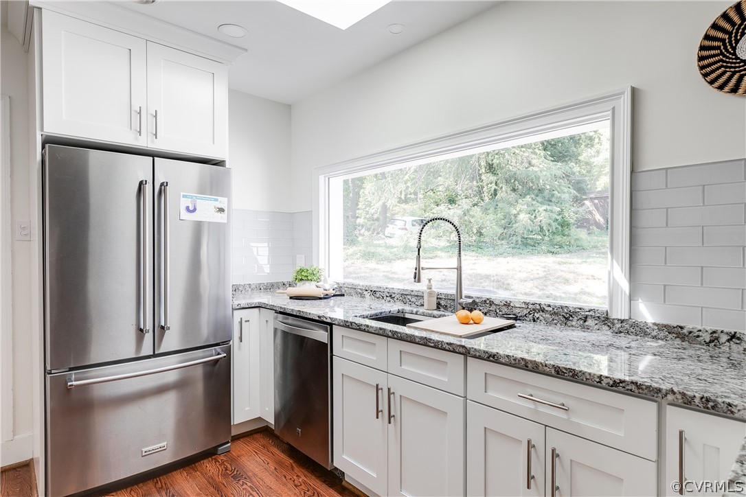 7607 Cherokee Road Richmond, VA 23225 - Photo 8 of 37 a kitchen with stainless steel appliances granite countertop a refrigerator sink and cabinets