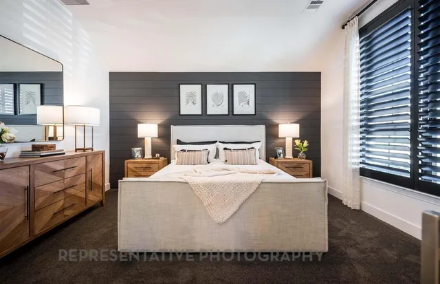 a large white bed in a white room